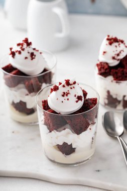 Red velvet trifle or parfait with cream cheese mousse and whipped cream, dessert in a glass idea
