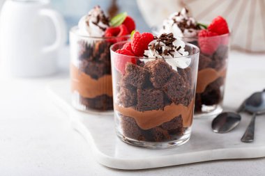 Chocolate trifle or parfait with raspberry, chocolate mousse and whipped cream