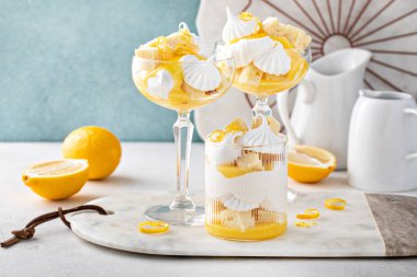 Lemon parfait with pound cake, lemon curd, whipped cream and meringue kisses