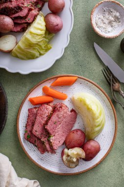 Corned beef with cabbage and potatoes dinner with soda bread, irish recipe idea for St Patricks day clipart