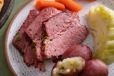 Corned beef with cabbage and potatoes dinner with soda bread, irish recipe idea for St Patricks day