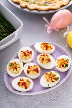 Deviled eggs with bacon and smoked paprika for Easter brunch