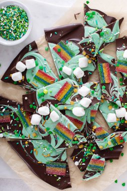 St Patricks day chocolate bark with sprinkles and rainbow candy, dessert idea