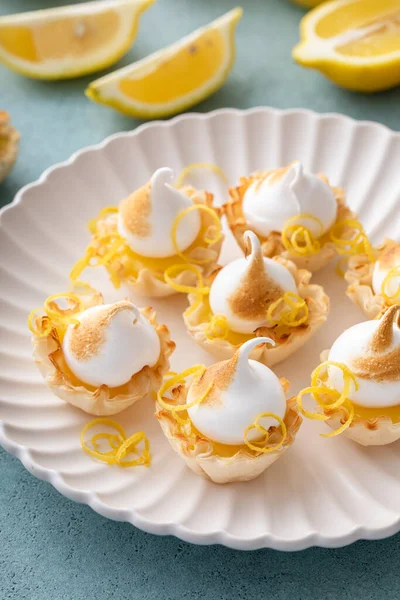 stock image Mini lemon meringue tarts filled with lemon curd, one bite desserts idea