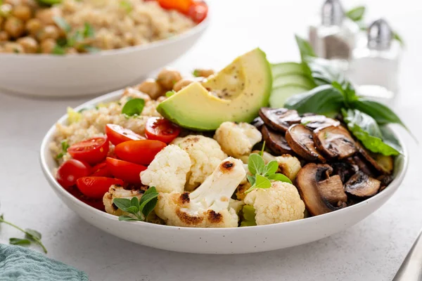 stock image Healthy high protein vegan plant based lunch bowl with mushrooms, roasted cauliflower, herbed chickpeas and quinoa