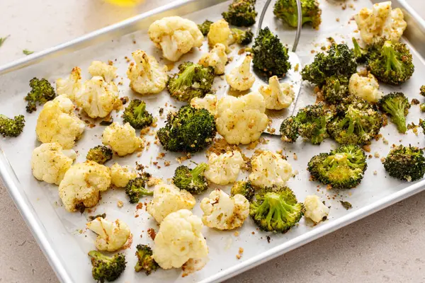 Roasted cauliflower and broccoli on a sheet pan, healthy vegetable side dish idea