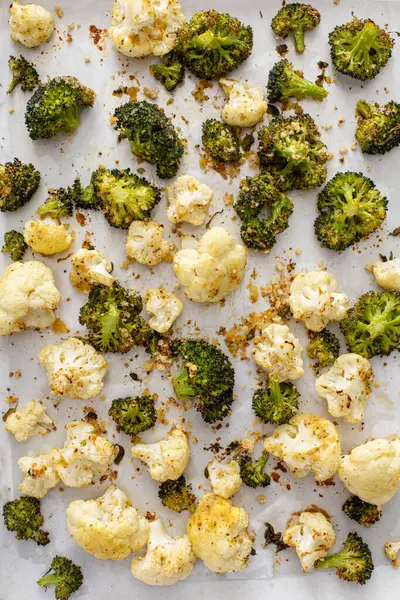 Roasted cauliflower and broccoli on a sheet pan, healthy vegetable side dish idea