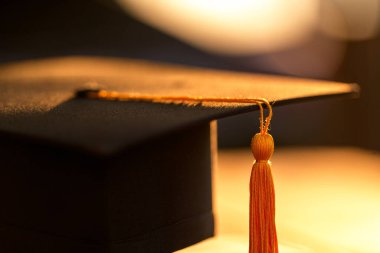 Graduation Cap university pace on wood table graduation concept