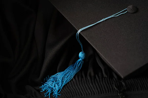 Black Graduation Cap university pace on graduation gown graduation concept