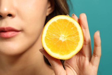 The beautiful  Asian woman showing skin with green background