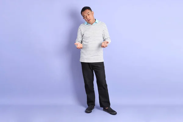 stock image The 40s adult Asian man with standing on the purple background.