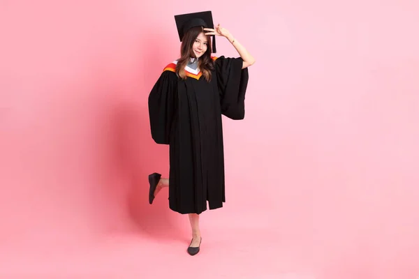 Asian Woman Graduation Gown Standing Pink Background — Stock Photo, Image