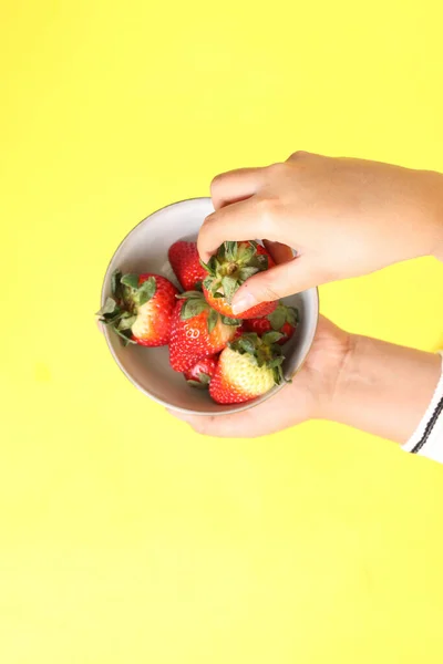 Asian Woman Holding Strawberry Hand Yellow Background — Stock Photo, Image