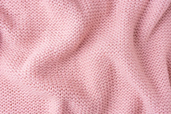 ビスコース糸で作られたニットウール生地の背景を閉じます 明るいピンク色のしわ編みウールニットのテクスチャ アブストラクトニットのしわジャージー生地の背景 — ストック写真