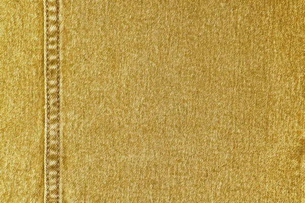 デニムジーンズの質感の背景 装飾的な縫い目と黄色の色の綿の生地のテクスチャ スティッチテクスチャジーンの背景 繊維と生地の構造 バナー ヘッダー — ストック写真