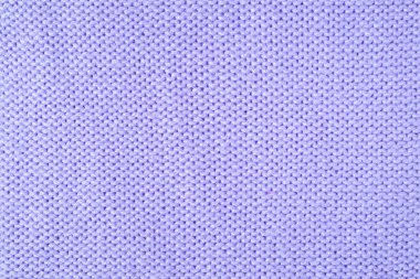 Yapışkan iplikten örülmüş yün kumaşın arka planını kapat. Pastel mor renkli yün örgü deseni. Soyut örgü forma arka planı. Kumaş soyut arkaplan, duvar kağıdı