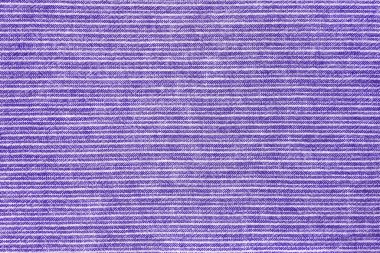Natural linen texture as background. Cotton fabric with purple and white line striped pattern, texture close up, top vies, flat lay. Backdrop, wallpaper. Matereal for clothes, curtain and upholstery