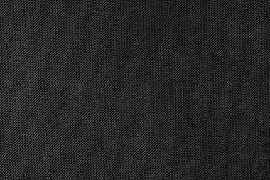 Texture background of velours black fabric. Upholstery velveteen texture fabric, corduroy furniture textile material, design interior, decor. Ridge fabric texture close up, backdrop, wallpaper.