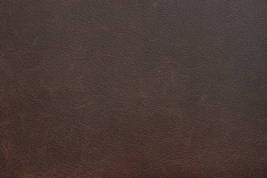 Hakiki, doğal, yapay kahverengi deri dokusu. Başlık, afiş, arkaplan, duvar kağıdı, kıyafet, mobilya ve iç tasarım için lüks malzeme. Çevresel dost deri..