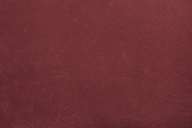Genuine, natural, artificial red leather texture background. Luxury material for header, banner, backdrop, wallpaper, clothes, furniture and interior design. ecological friendly leatherette.