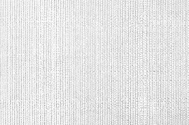 Close-up texture of natural white coarse weave fabric or cloth. Fabric texture of natural cotton or linen textile material. Blue canvas background. Decorative fabric for upholstery, furniture, walls