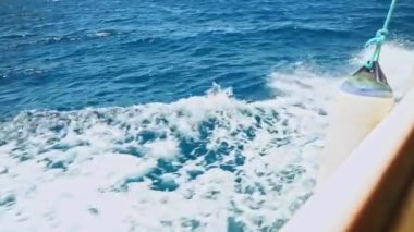 Sea or ocean splash waves and foam after speed motor boat or yacht, wake of vessel. Vacation, summer holiday, cruise, sea travel. High quality FullHD footage
