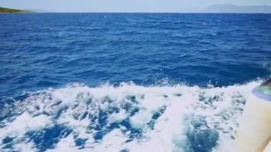 Sea or ocean splash waves and foam after speed motor boat or yacht, wake of vessel. Vacation, summer holiday, cruise, sea travel. High quality FullHD footage