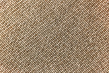 Arka plan olarak doğal keten dokusu. Kahverengi ve beyaz köşegen desenli pamuk kumaş, dokusu yakın. Arkaplan, duvar kağıdı. Giysiler, perdeler ve döşemeler için malzeme