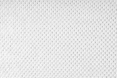 Close up background of knitted wool fabric with dots pattern. White color wool knitwear texture. Openwork abstract knitted jersey. Fabric abstract backdrop clipart