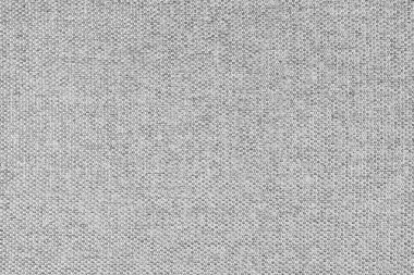 Doğal açık gri kabuklu kumaş ya da kumaşın yakın çekim dokusu. Doğal pamuk veya keten kumaş dokusu. Mavi tuval arka plan. Döşemeler ve mobilyalar için dekoratif kumaş