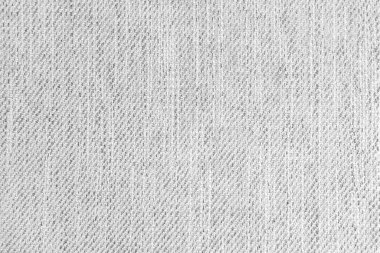 Jacquard woven upholstery, white coarse fabric texture. Textile background, furniture textile material, wallpaper, backdrop. Cloth structure close up.