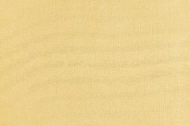 Texture background of yellow cotton fabric. Textile structure, cloth surface, weaving of linen fabric closeup, backdrop, wallpaper.