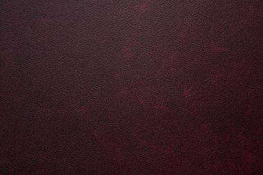 Genuine, natural, artificial red leather texture background. Luxury material for header, banner, backdrop, wallpaper, clothes, furniture and interior design. ecological friendly leatherette.