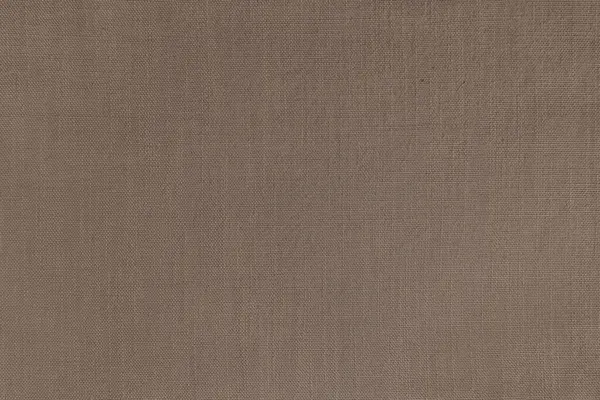Texture background of brown linen fabric. Textile structure, cloth surface, weaving of natural cotton fabric closeup, backdrop, wallpaper.