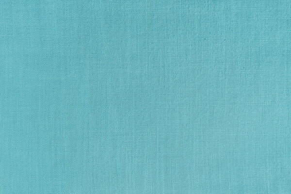 Texture background of cyan linen fabric. Textile structure, cloth surface, weaving of natural cotton fabric closeup, backdrop, wallpaper.