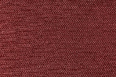 Tekstil arka kapısı, kırmızı kaba kumaş dokusu, jakuzi döşemesi, mobilya tekstil malzemesi, duvar kağıdı, fon. Kumaş yapısı kapat.