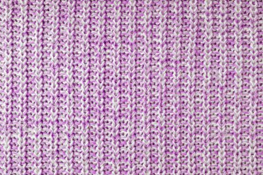 Jersey tekstil arka planı, pembe beyaz yün örgü kumaş. Yünlü örgü, kazak, kazak, kazak yüzey dokusu, tekstil yapısı, kumaş yüzey, örgü kumaş dokusu.