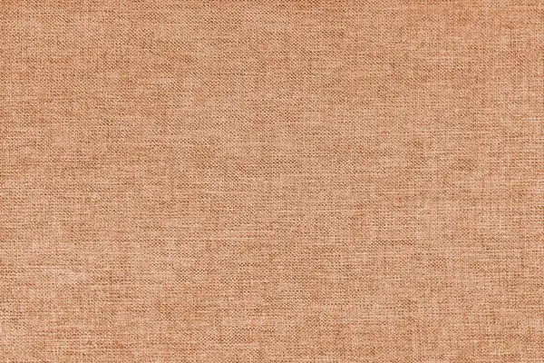 Textile background, orange coarse fabric texture, cloth structure close up, jacquard woven upholstery, furniture textile material, wallpaper, backdrop