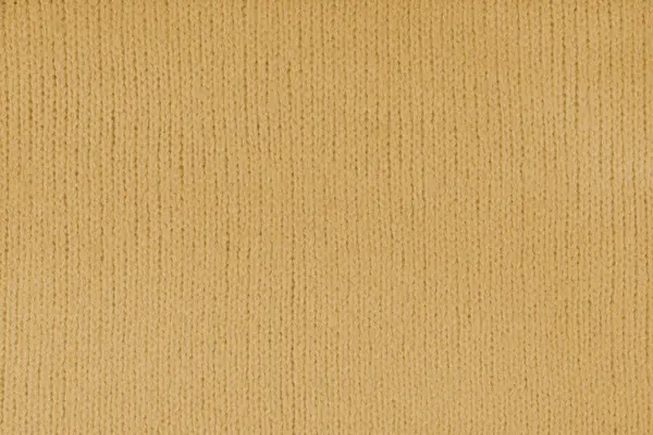 Yellow knitted woolen jersey fabric, sweater, pullover texture background. Fabric abstract backdrop, cloth wallpaper