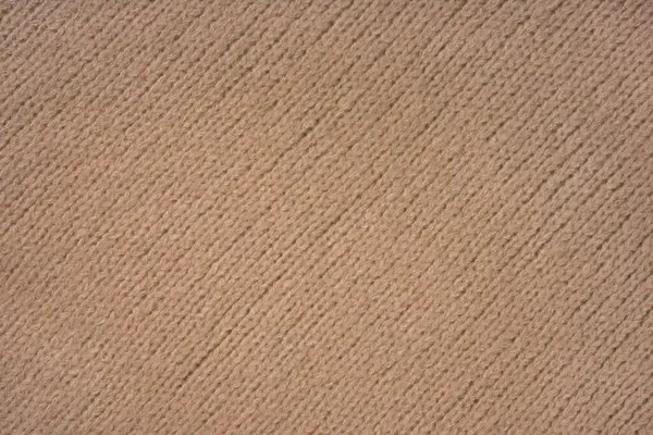 Brown knitted woolen jersey fabric with diagonal weaving, sweater, pullover texture background. Fabric abstract backdrop, cloth wallpaper