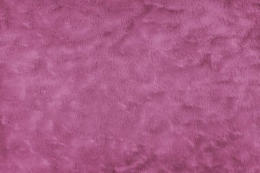 Kabarık pembe döşeme kumaşı ya da kumaş dokusu. Yapay kürk kumaşının kumaş dokusu. Tuvalin arka planı. Perde, mobilya, duvar ve kıyafetler için dekoratif kumaş.
