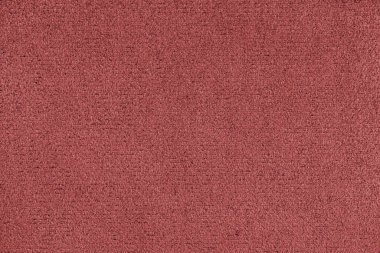 Düz kırmızı renkli mikrofiber detay dokusu. Süet deri döşeme, kapanış, makro. Duvar kağıdı, arkaplan, tekstil arkaplanı.