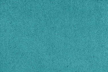 Düz turkuaz renkli mikro fiber doku. Süet deri döşeme, kapanış, makro. Duvar kağıdı, arkaplan, tekstil arkaplanı.