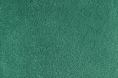 Kabartmalı benekli yeşil süet deri desenli. Tüylü kumaş yüzey, dekoratif döşeme, ev dekorasyonu ve giysi. Duvar kağıdı, arkaplan, arkaplan.