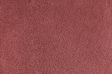 Kabartmalı benekli kırmızı süet deri desenli. Tüylü kumaş yüzey, dekoratif döşeme, ev dekorasyonu ve giysi. Duvar kağıdı, arkaplan, arkaplan.