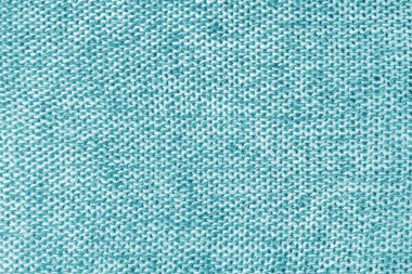 Karışık beyaz ve turkuaz renkli melanj örgü kumaş, kaşmir yün kumaş dokusu. Örgü kumaşının arka planı, Jersey tekstil yapısı, kumaş yüzeyi, örgü kumaş dokuması..