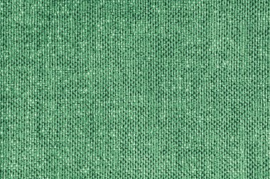 Döşeme yeşili renkli Jacquard kumaş kabarık dokuma dokusu yakın, makro. Tekstil arka planı, mobilya tekstil malzemesi, duvar kağıdı, fon. Kumaş yapısı kapat, makro