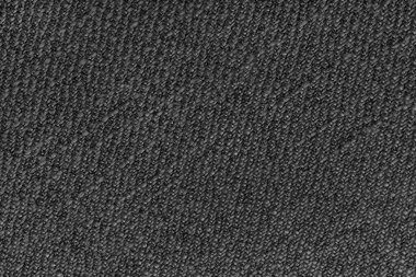 Black  Jacquard fabric with diagonal woven, coarse weave texture upholstery cloth. Textile background, furniture textile material, wallpaper, backdrop. Cloth structure close up, macro.