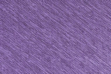 Yakın plan, mor kumaş dokusu arka plan makrosu. Saten köşegen kumaş yapısı, tuval. Dekor için tekstil, döşeme, giysi. Duvar kağıdı, arkaplan.