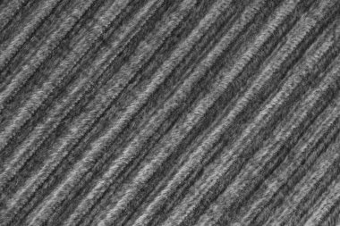 Kadife kadife siyah kumaştan tepe makro desenli. Büyük tırtıklı, köşegen şeklinde kadife dokuma, çizgili döşeme kumaşı kumaş arka plan, mobilya tekstil malzemesi, tasarım, dekor